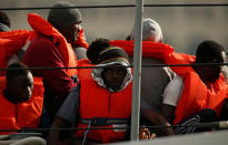 Migrants sit on an Armed Forces of Malta patrol boat before disembarking at its base in Marsamxett Harbour, Valletta, Malta May 25, 2019. REUTERS/Darrin Zammit Lupi