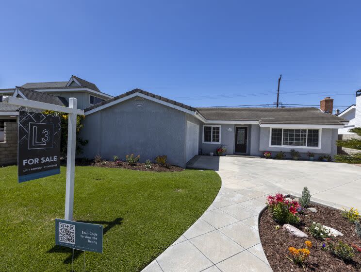 Huntington Beach, CA - April 22: A view of a home for sale at center of photo, 20821 Catamaran Ln. in Huntington Beach, listed at $1,199,000 Friday, April 22, 2022. The median home price in Orange Count has reached $1 million for the first time in history. (Allen J. Schaben / Los Angeles Times)