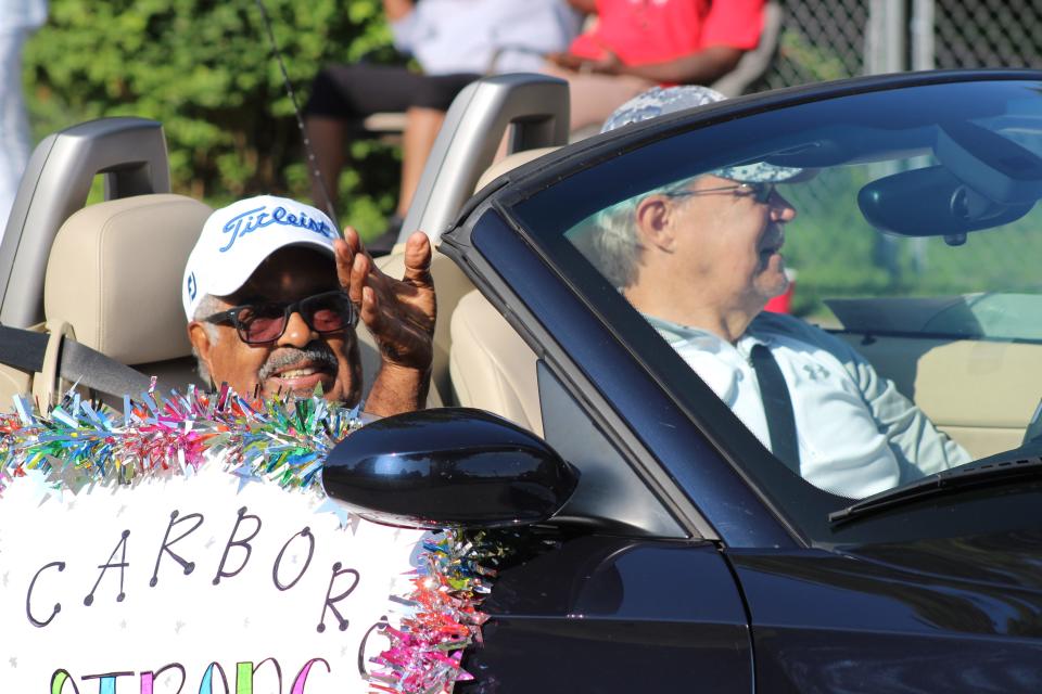 "Scarboro 85" member L.C. "Larry" Gipson waves from a car during the Unity Parade on Saturday, Sept. 4. The "Oak Ridge 85," who were the first students to integrate a school in the Southeast following the U.S. Supreme Court decision on desegregation, were the parade's grand marshals.