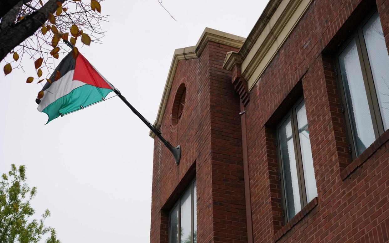 The flag of the Palestine Liberation Organisation is seen above its offices in Washington, DC - AFP