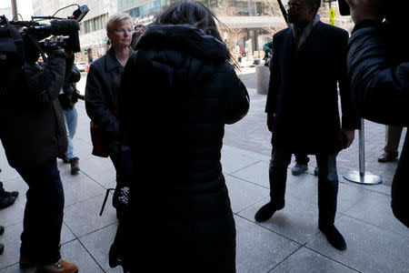 Donna Heinel, former associate athletic director at the University of Southern California (USC) facing charges in a nationwide college admissions cheating scheme, arrives at the federal courthouse in Boston, Massachusetts, U.S., March 25, 2019. REUTERS/Brian Snyder