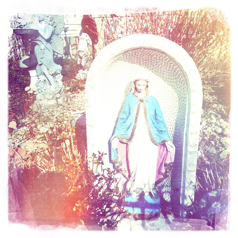 The Virgin in front of the house