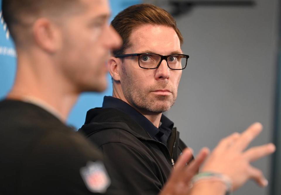 Carolina Panthers general manager Dan Morgan, right, listens to head coach Dave Canales’ response to a question during a pre-draft press conference at Bank of America Stadium on Thursday, April 18, 2024.