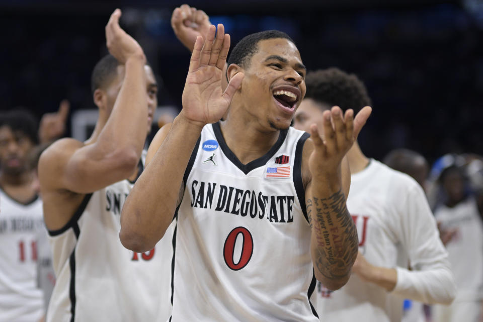 San Diego State forward Keshad Johnson (0) celebrates after their win against Furman in a second-round college basketball game in the NCAA Tournament, Saturday, March 18, 2023, in Orlando, Fla. (AP Photo/Phelan M. Ebenhack)