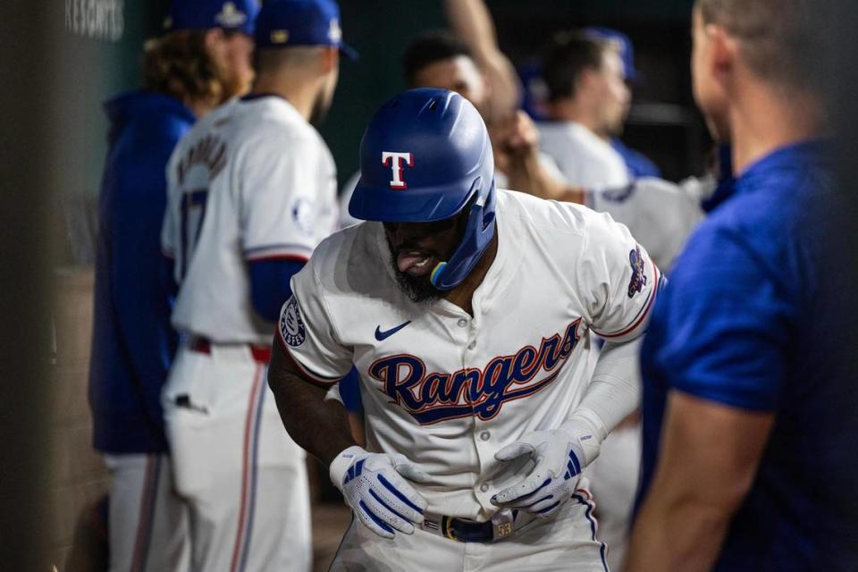 Texas Rangers outfielder Adolis Garcia (53) celebrates in the dugout after hitting his first home run of the season in the sixth inning of the season opener against the Chicago Cubs at Globe Life Field in Arlington on Thursday, March 28, 2024. Chris Torres/ctorres@star-telegram.com