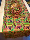 <p><strong>buythedress</strong></p><p>etsy.com</p><p><strong>$34.99</strong></p><p>Made by hand with 100 percent cotton, this Kente fabric table runner (which comes in two size options, as well as two color options) will make any table look like something straight out of a glossy magazine. </p>