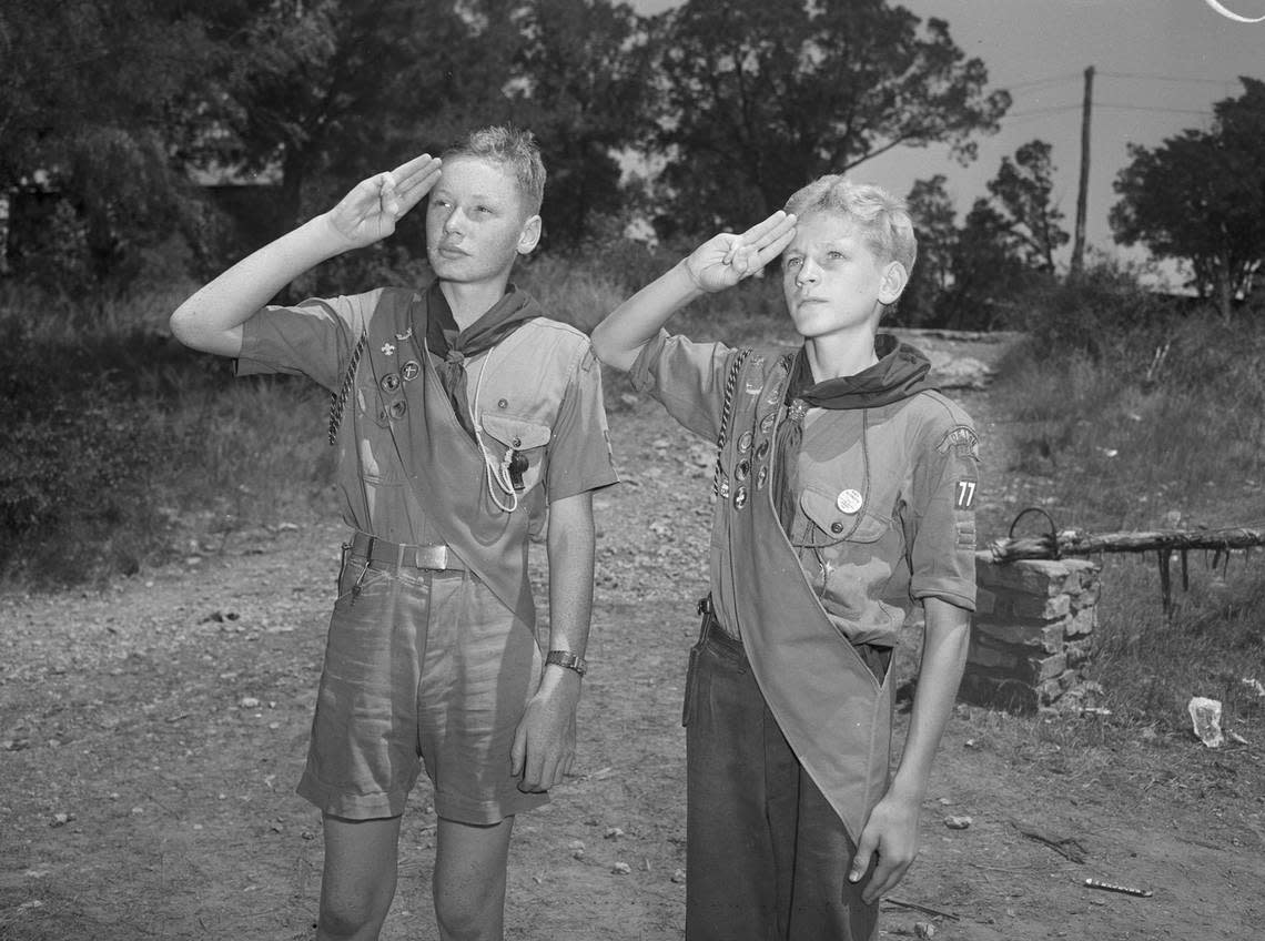 July 26, 1944: Saluting the flag at a retreat at Worth Ranch, Boy Scout camp near Palo Pinto, are Wayne Wilkins (left), son of Mr. and Mrs. Earl Wilkins and Fred Coffey Jr., son of Mr. and Mrs. Fred Coffey, all of Denton, Texas. Fort Worth Star-Telegram archive/UT Arlington Special Collections