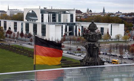 A German national flag flutters in front of the Chancellery in Berlin October 27, 2013. REUTERS/Fabrizio Bensch