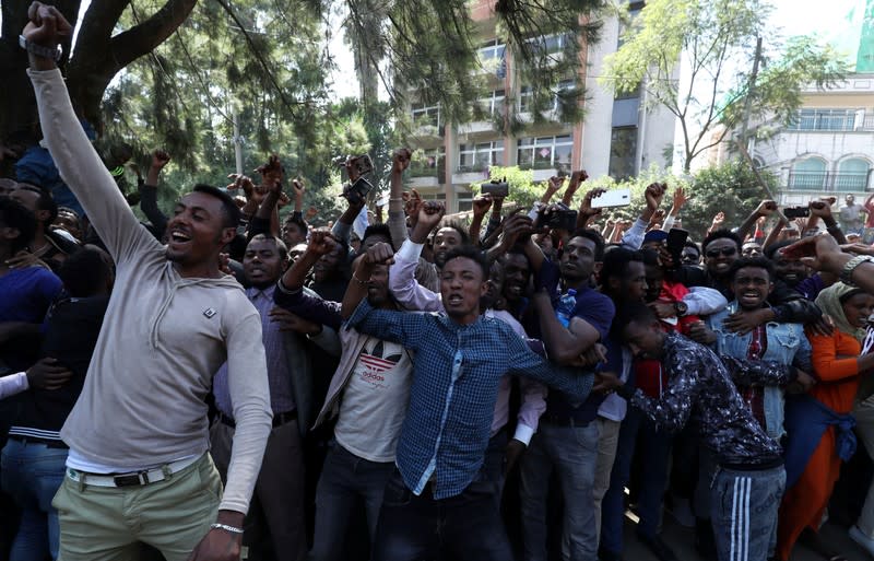 Oromo youth shout slogans outside Jawar Mohammed's house, an Oromo activist and leader of the Oromo protest in Addis Ababa