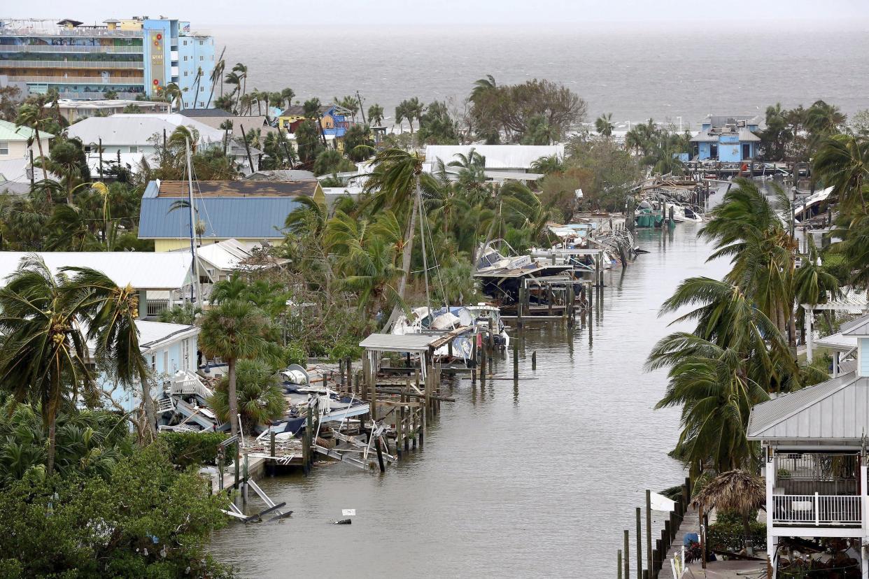 Homes, boats and docks lay in ruin in Fort Myers Beach, Fla., on Thursday, Sep 29, 2022, following Hurricane Ian.