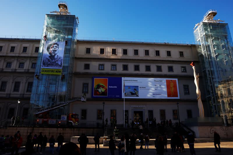 Greenpeace activists display illustration on Reina Sofia Museum in Madrid