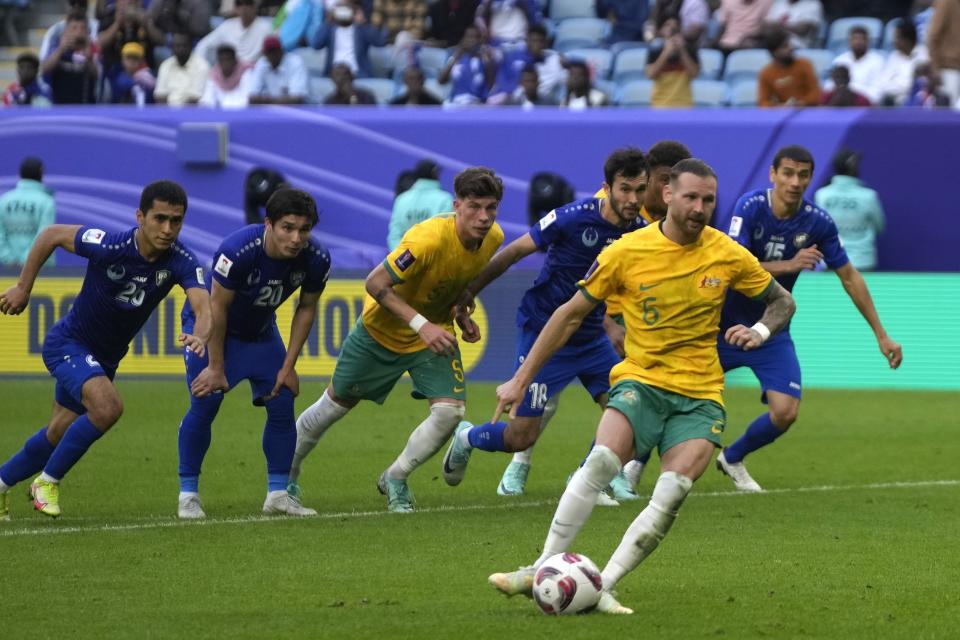 Australia's Martin Boyle scores the first goal during the Asian Cup Group B soccer match between Australia and Uzbekistan at Al Janoub Stadium in Doha, Qatar, Tuesday, Jan. 23, 2024. (AP Photo/Thanassis Stavrakis)