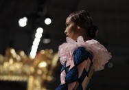 Model Bella Hadid wears a creation as part of the Moschino Spring-Summer 2020 collection, unveiled during the fashion week, in Milan, Italy, Thursday, Sept. 19, 2019. (AP Photo/Luca Bruno)