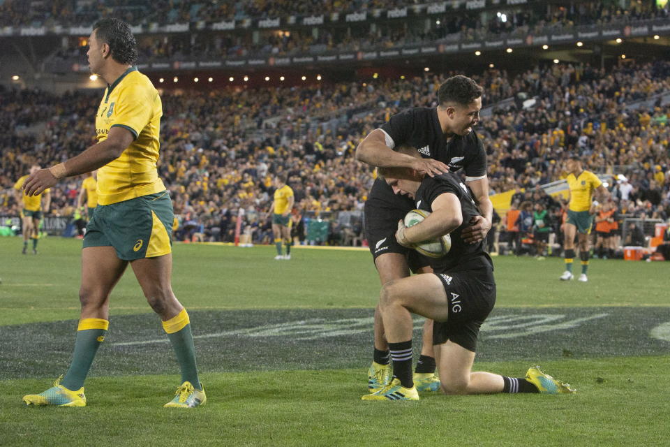 Jack Goodhue celebrates with Anton Lienert-Brown after scoring his try in Sydney