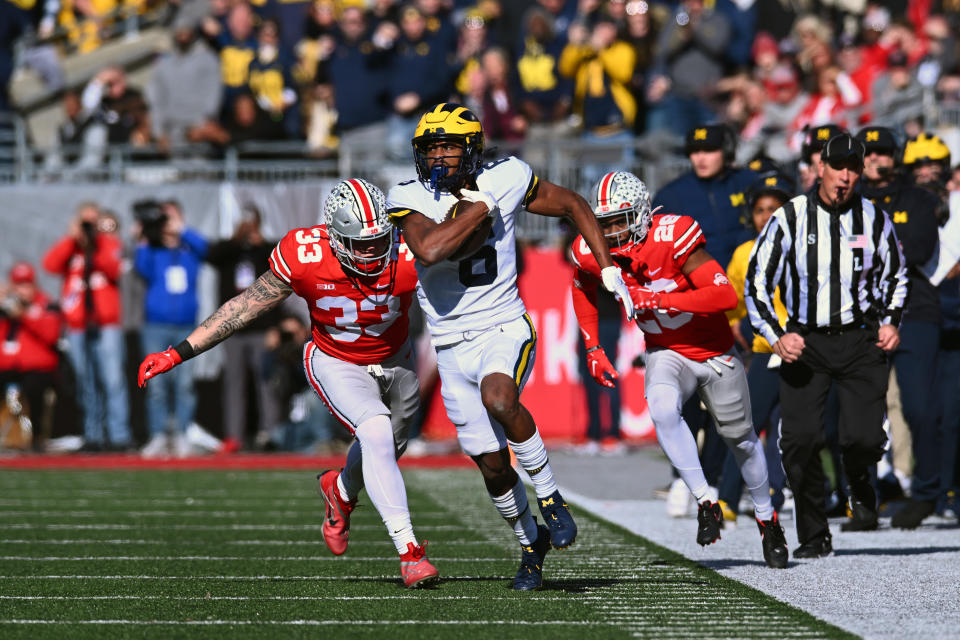Michigan receiver Cornelius Johnson runs with the ball after the catch against Ohio State at Ohio Stadium on November 26, 2022 in Columbus, Ohio. (Photo by Ben Jackson/Getty Images)