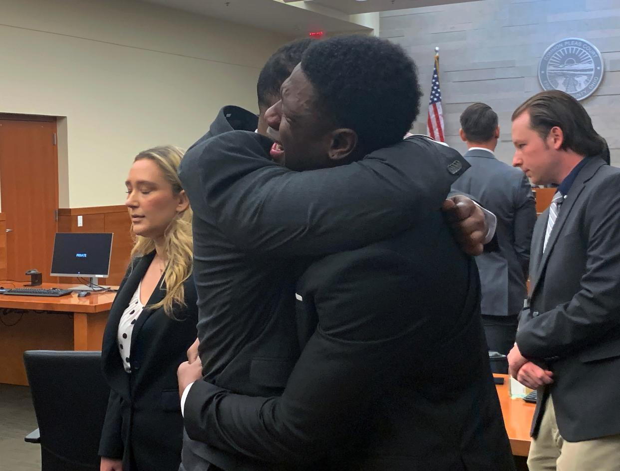 Amir I. Riep and Jahsen L. Wint (foreground), both 24, embrace on Feb. 9, 2023 after a Franklin County jury found them not guilty of a 2020 rape.  Riep and Wint were defensive players for the Ohio State University football team when a woman in her freshman year at Ohio State accused them of raping her on Feb. 4, 2020.