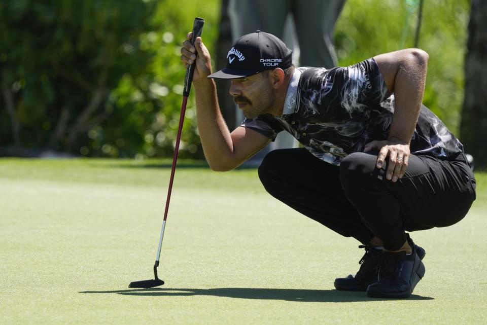 Erik van Rooyen, of South Africa, studies his putt on the 9th green during the second round of the Mexico Open golf tournament in Puerto Vallarta, Mexico, Friday, Feb. 23, 2024. (AP Photo/Fernando Llano)