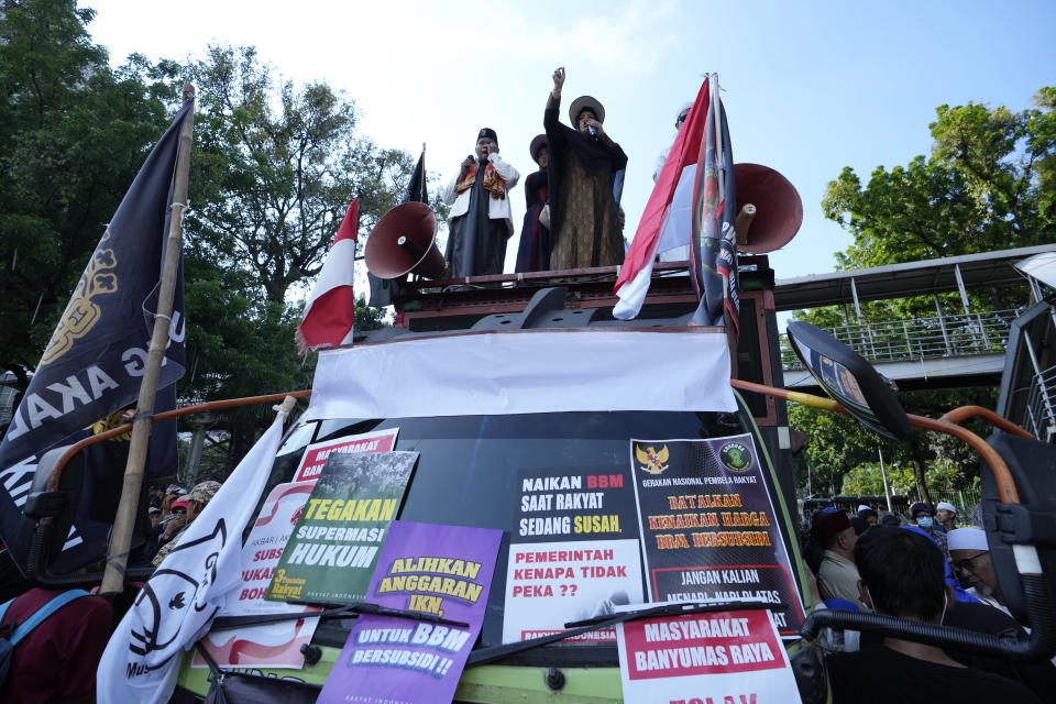 A protester shouts slogans during a rally against sharp increases in fuel prices in Jakarta, Indonesia, Monday, Sept. 12, 2022. Hundreds of conservative Muslims marched in Indonesia's capital on Monday demanding that the government revoke its decision to raise fuel prices, saying it hurts people already reeling from the economic impact of the pandemic. (AP Photo/Achmad Ibrahim)