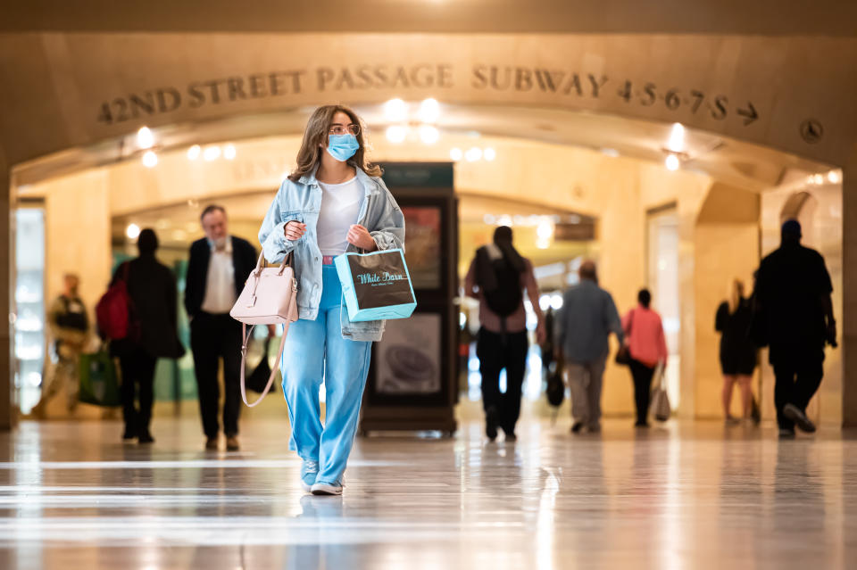 NEW YORK, NEW YORK - SEPTEMBER 30: A person wears a face mask inside Grand Central Terminal as the city continues Phase 4 of re-opening following restrictions imposed to slow the spread of coronavirus on September 30, 2020 in New York City. The fourth phase allows outdoor arts and entertainment, sporting events without fans and media production. (Photo by Noam Galai/Getty Images)