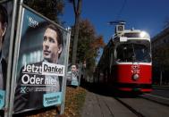 A sticker reading "Thank you!" is seen on an election campaign poster with Sebastian Kurz of the Peoples' Party (OeVP) as a tramway passes in Vienna, Austria, October 16, 2017. REUTERS/Heinz-Peter Bader