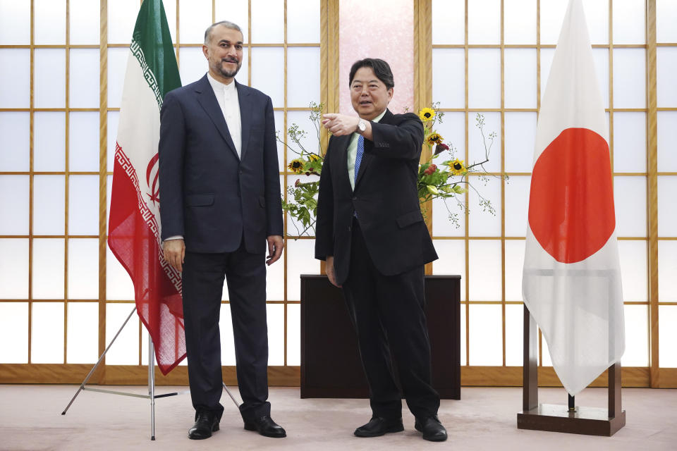 Japanese Foreign Minister Yoshimasa Hayashi, right, escorts Iranian counterpart Hossein Amir-Abdollahian before their meeting Monday, Aug. 7, 2023, in Tokyo. (AP Photo/Eugene Hoshiko)