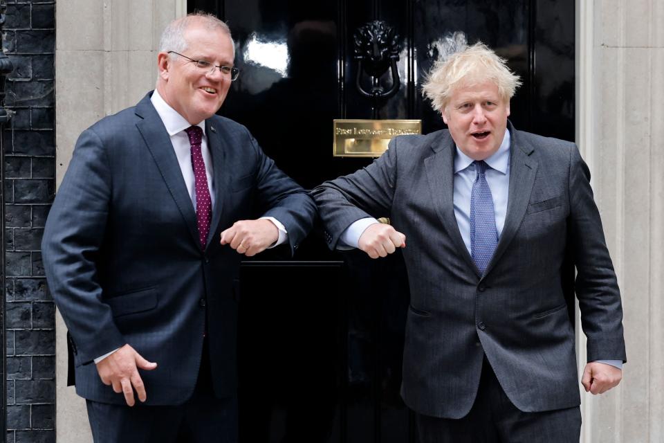 Boris Johnson greets Scott Morrison at 10 Downing Street on Monday (AFP via Getty Images)