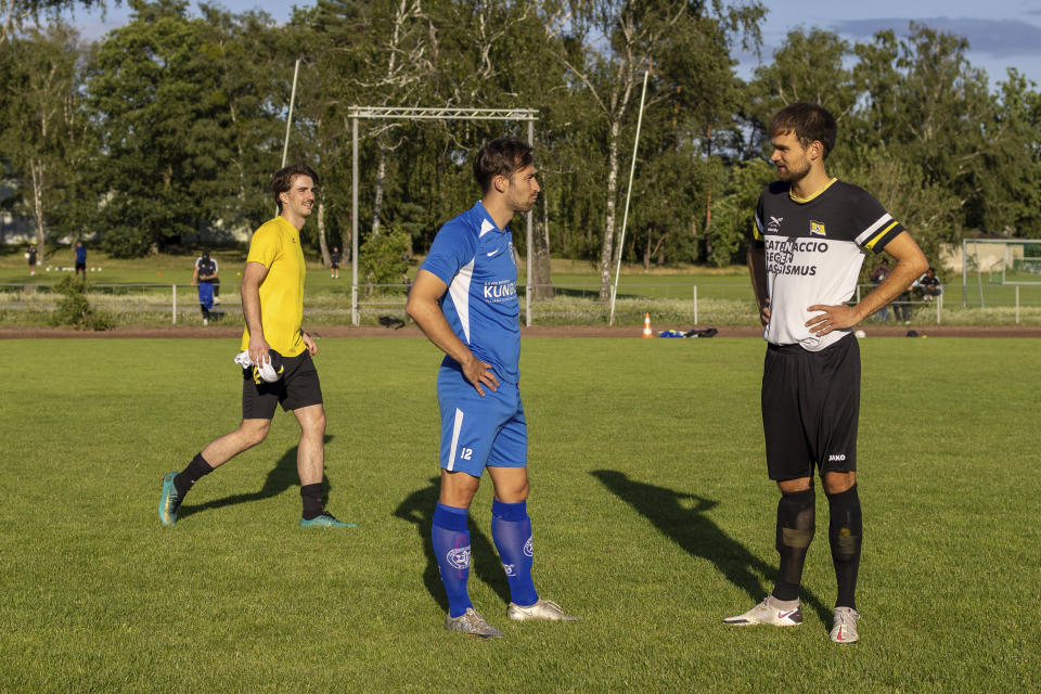 Players from Makkabi Berlin and Hansa Berlin before a practice match, in Berlin, Wednesday, July 26, 2023. When Makkabi Berlin takes the field on Sunday Aug. 13, 2023, the soccer club founded by Holocaust survivors will become the first Jewish team to play in the German Cup. (AP Photo/Ciaran Fahey)