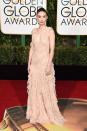 <p>Rooney Mara must’ve really loved what she was wearing — a blush ruffly number — because she smiled on the red carpet! She added some color to the pale ensemble with a red lip and pulled her hair back into a high ponytail. </p>