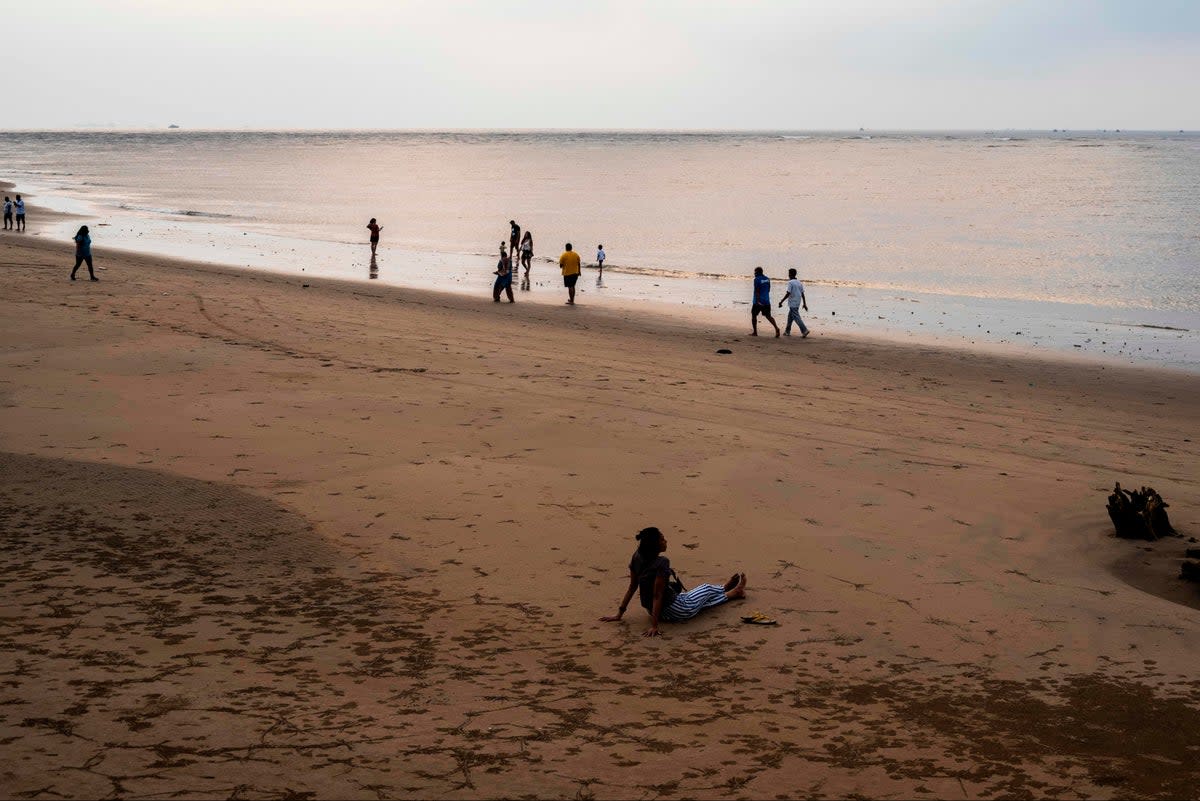 People walk along a beach in Goa (stock image)  (AFP via Getty Images)