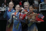 Bradie Tennell, Isabeau Levito, Amber Glenn and Starr Andrews, from left, hold up their medals after the women's free skate at the U.S. figure skating championships in San Jose, Calif., Friday, Jan. 27, 2023. Levito finished first, Tennell finished second, Glenn finished third and Andrews finished fourth in the event. (AP Photo/Josie Lepe)
