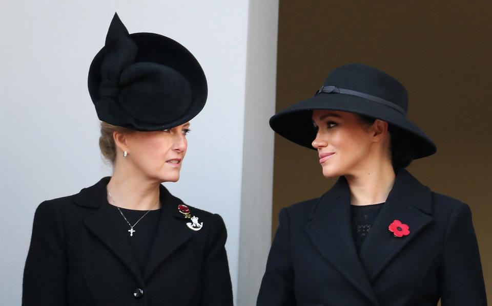 Meghan stood next to the Queen’s daughter-in-law,<a href="https://people.com/tag/sophie-of-wessex/" rel="nofollow noopener" target="_blank" data-ylk="slk:Sophie, Countess of Wessex;elm:context_link;itc:0;sec:content-canvas" class="link "> Sophie, Countess of Wessex</a>, as well as Sir Timothy Laurence, <a href="https://people.com/tag/princess-anne/" rel="nofollow noopener" target="_blank" data-ylk="slk:Princess Anne;elm:context_link;itc:0;sec:content-canvas" class="link ">Princess Anne</a>‘s husband.