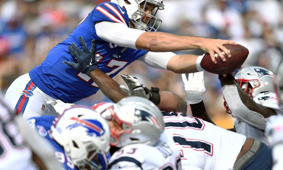 Buffalo Bills quarterback Josh Allen dives over the line of scrimmage to score a touchdown against the New England Patriots in the second half of an NFL football game, Sunday, Sept. 29, 2019, in Orchard Park, N.Y. (AP Photo/Adrian Kraus)