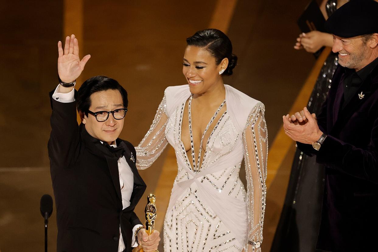 Ke Huy Quan accepts the Best Supporting Actor award "Everything Everywhere All at Once" from Ariana DeBose and Troy Kotsur onstage during the 95th Annual Academy Awards at Dolby Theatre on March 12, 2023 in Hollywood, California.