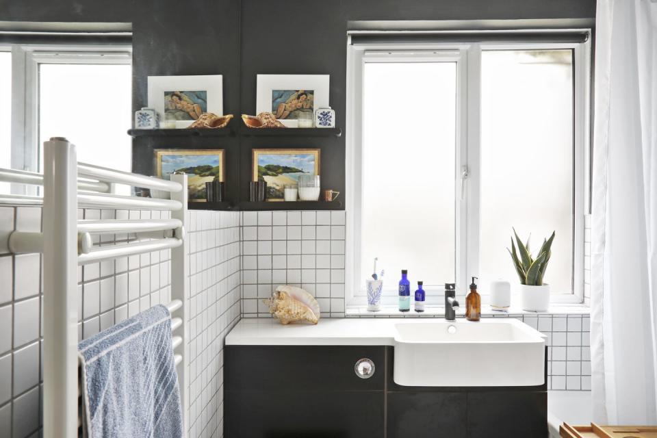 a bathroom with a sink and a window