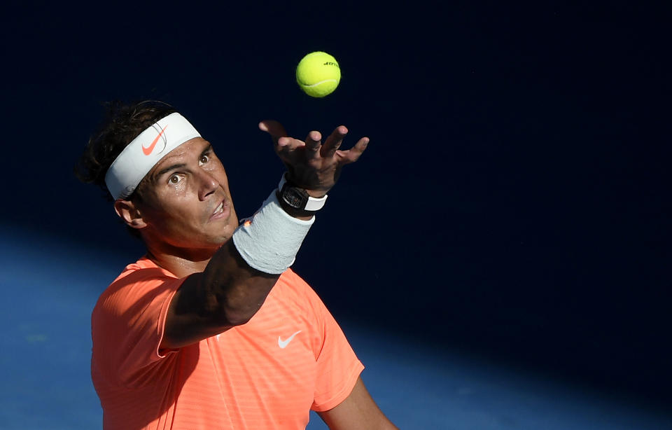 Spain's Rafael Nadal serves to Italy's Fabio Fognini during their fourth round match at the Australian Open tennis championship in Melbourne, Australia, Monday, Feb. 15, 2021.(AP Photo/Andy Brownbill)