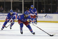 New York Rangers center Mika Zibanejad (93) skates with the puck on a fast break against the Tampa Bay Lightning during the second period of an NHL hockey game, Sunday, Jan 2, 2022, at Madison Square Garden in New York. (AP Photo/Rich Schultz)