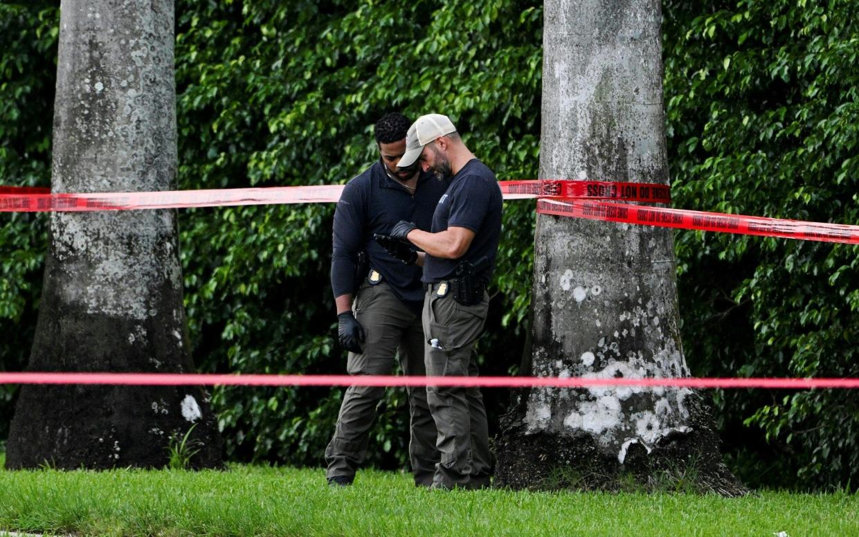 Members of FBI at the crime scene outside the Trump International Golf Club