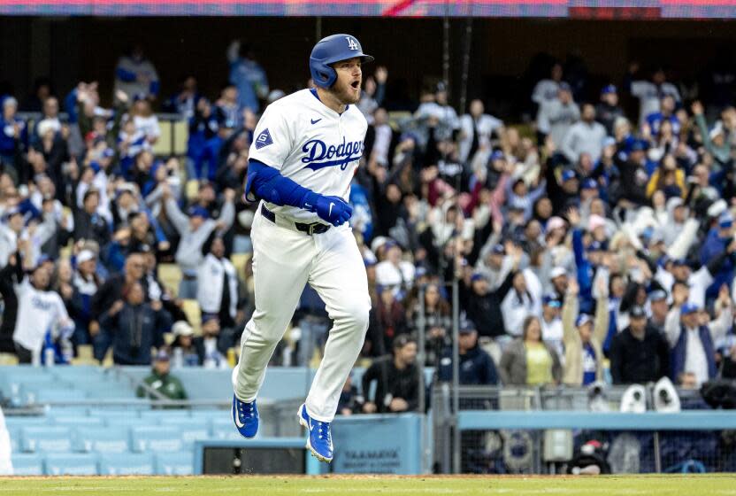 LOS ANGELES, CA - MARCH 31, 2024: Los Angeles Dodgers third baseman Max Muncy (13) leaps.