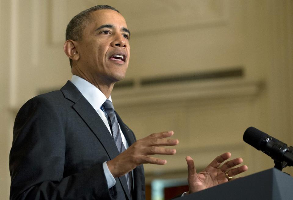 President Barack Obama gestures as he speaks in the East Room of the White House, Friday, Jan. 31, 2014, in Washington, about helping the long-term unemployed. (AP Photo/Carolyn Kaster)