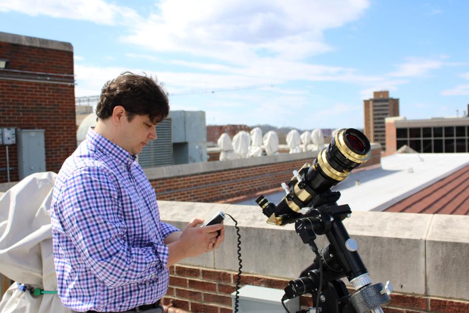 Senior lecturer and astronomy coordinator Sean Lindsay sets up a solar telescope on top of the Nielsen Physics building at the University of Tennessee at Knoxville. March 18, 2024.
