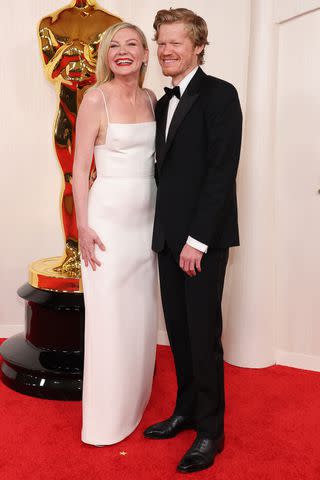 <p>Mike Coppola/Getty</p> Kirsten Dunst and Jesse Plemons at the 96th Academy Awards in Los Angeles on March 10, 2024