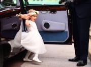 <p>One bridesmaid makes an adorable entrance. </p>