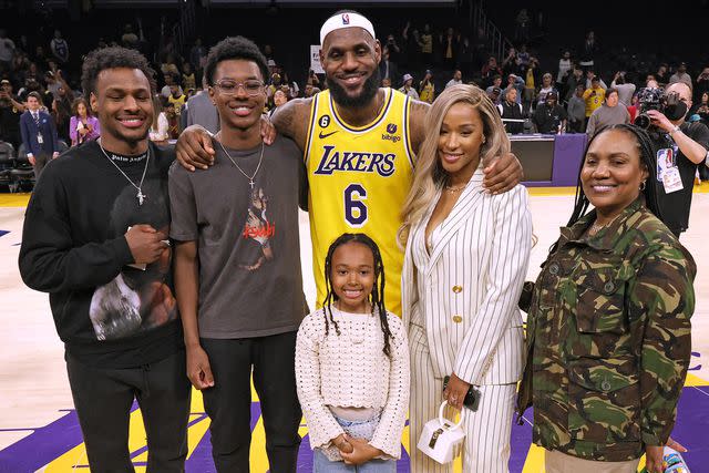 Harry How/Getty LeBron James #6 of the Los Angeles Lakers poses for a picture with his family at the end of the game, (L-R) Bronny James, Bryce James, Zhuri James Savannah James and Gloria James