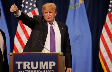 Republican U.S. presidential candidate Donald Trump gives a thumbs up to the crowd after addressing supporters after being declared by the television networks as the winner of the Nevada Repulican caucuses at his caucus night rally in Las Vegas, Nevada, February 23, 2016. REUTERS/Jim Young