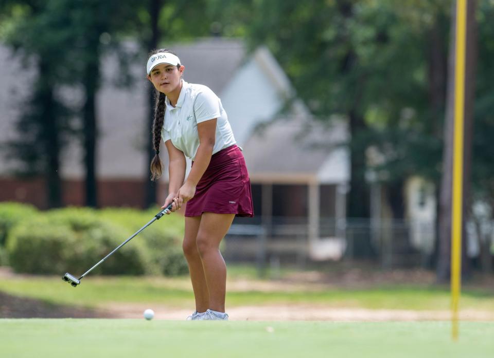 Michelle Burt putts during the Cook Family Classic summer tour golf tournament at the Tanglewood Golf Club in Milton on Thursday, June 8, 2023.