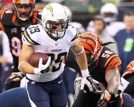 Jan 5, 2014; Cincinnati, OH, USA; San Diego Chargers running back Danny Woodhead (39) runs the ball during the third quarter against the Cincinnati Bengals during the AFC wild card playoff football game at Paul Brown Stadium. Mandatory Credit: Pat Lovell-USA TODAY Sports