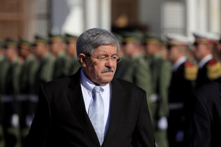 FILE PHOTO: Algerian Prime Minister Ouyahia awaits arrival of French President Macron at Houari Boumediene airport in Algiers