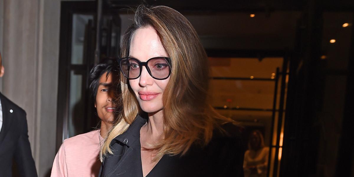 Angelina Jolie's Airport Attire Includes a Black Coat and a Celine