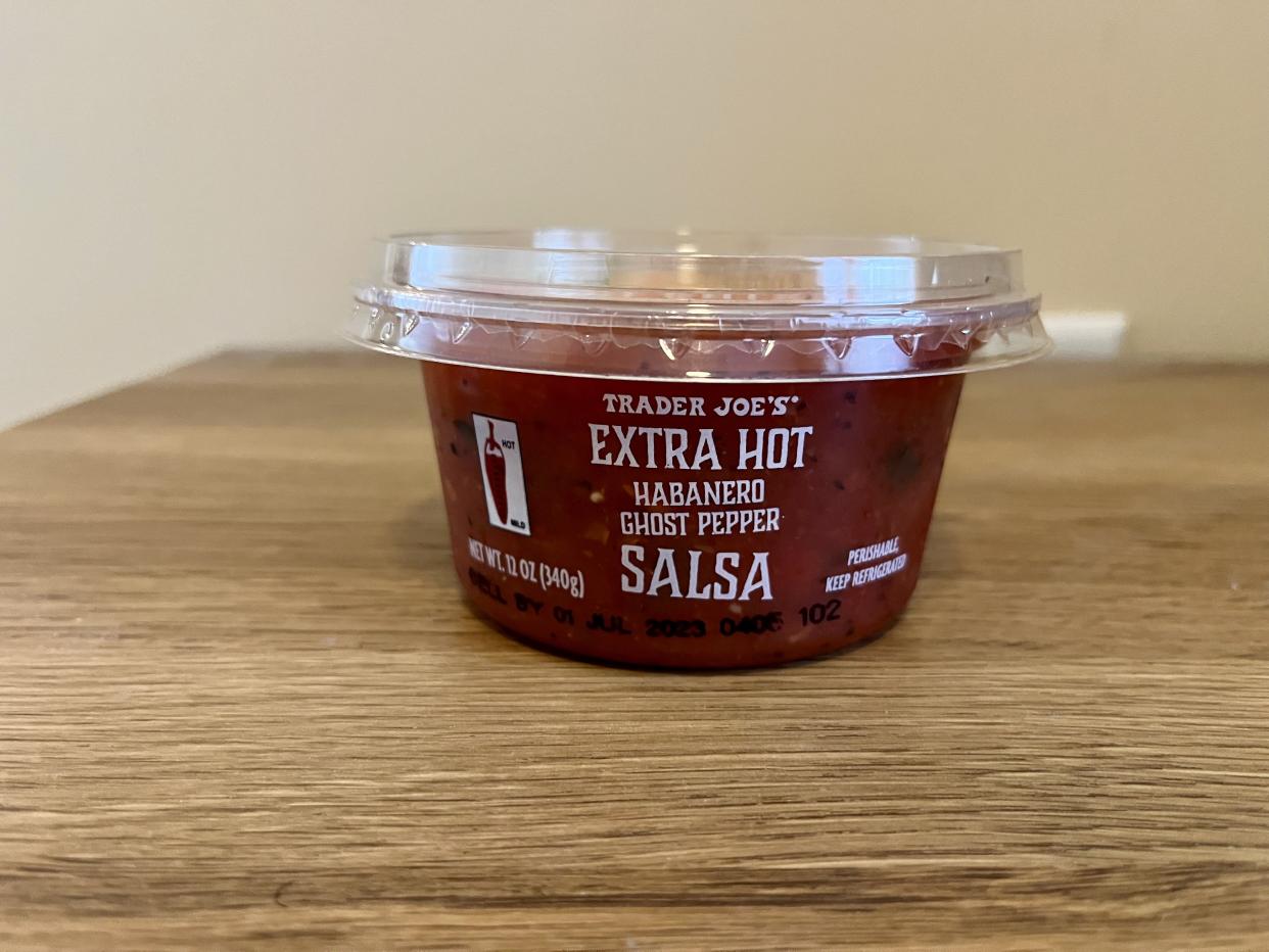 a tub of fresh Extra Hot Habanero Ghost Pepper Salsa from trader joes