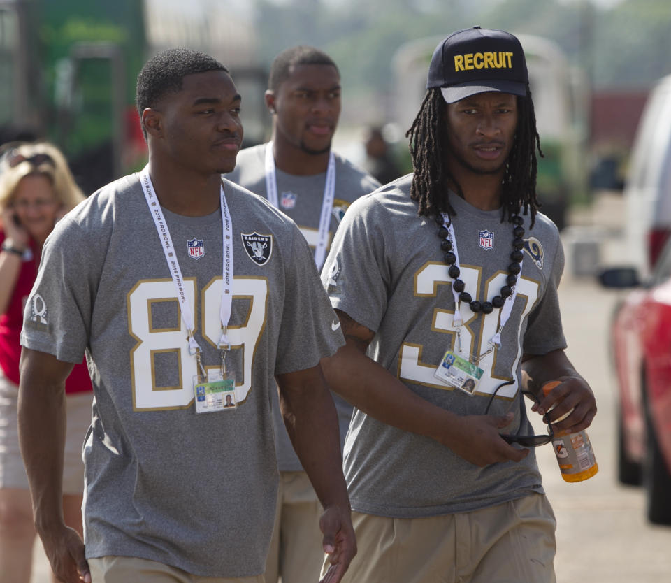 Oakland Raiders wide receiver Amari Cooper (89) and St. Louis Rams running back Todd Gurley (30) arrive for the NFL Pro Bowl football draft, Wednesday, Jan. 27, 2016, in Wahiawa, Hawaii. (AP Photo/Marco Garcia)